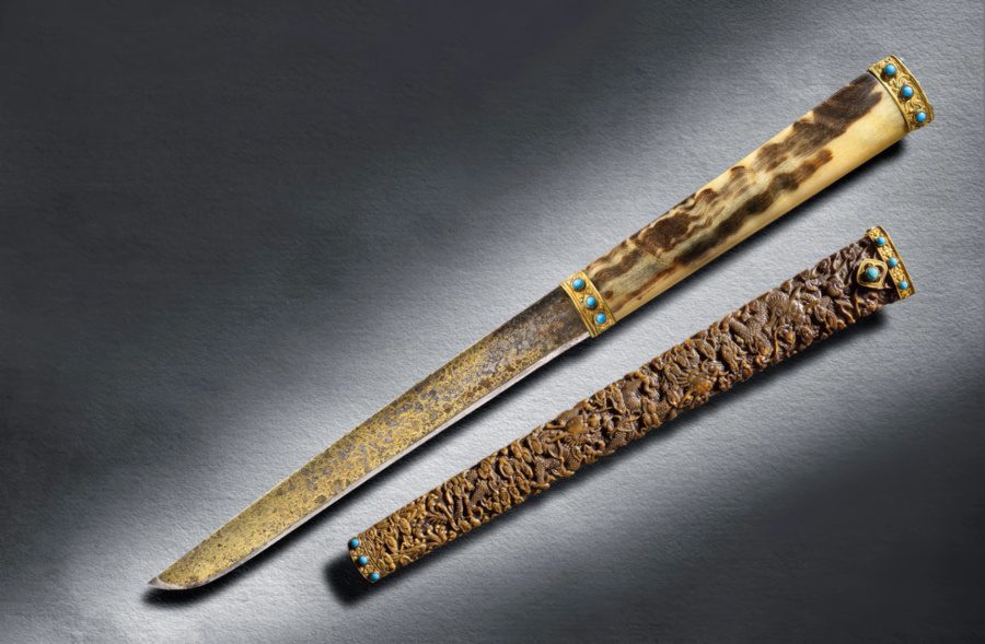 An Imperial hunting knife with rhinoceros horn scabbard Mark and Period of Qianlong