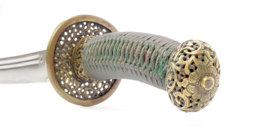 A Chinese saber pommel of the round style Late 18th early 19th century